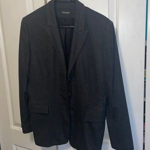 Beautiful woman black with white stripes blazer jacket.